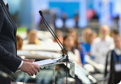 person speaking at podium